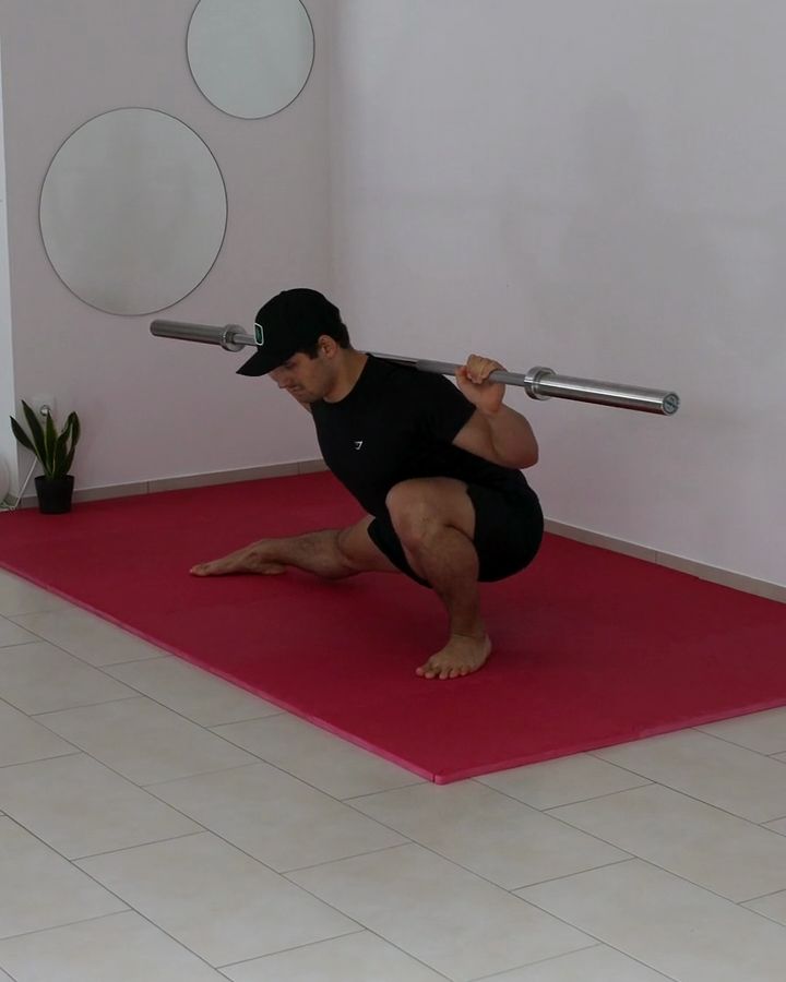 Weighted Cossack Squats with a barbell