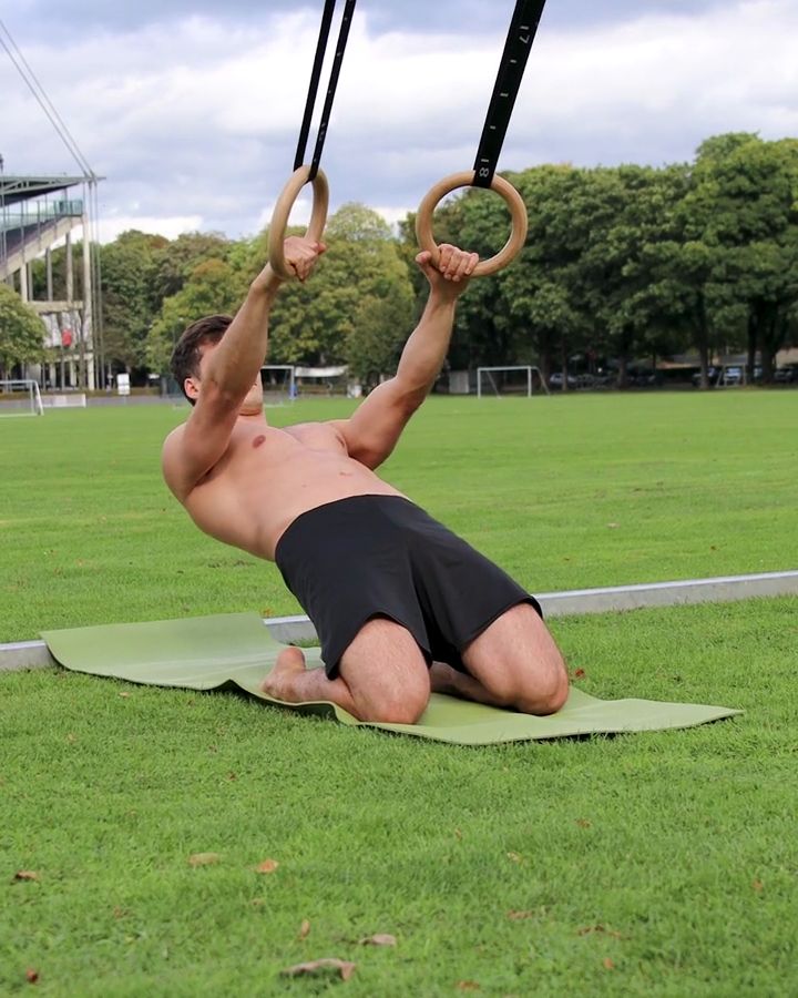 Assisted Reverse Nordic Curls with gym rings