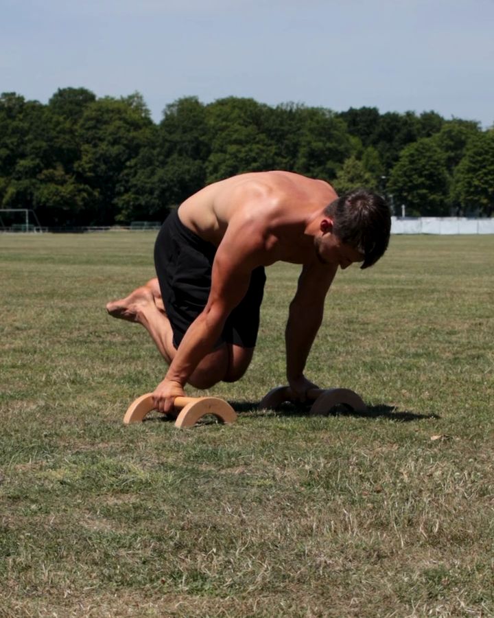 Advanced Tuck Planche with parallettes