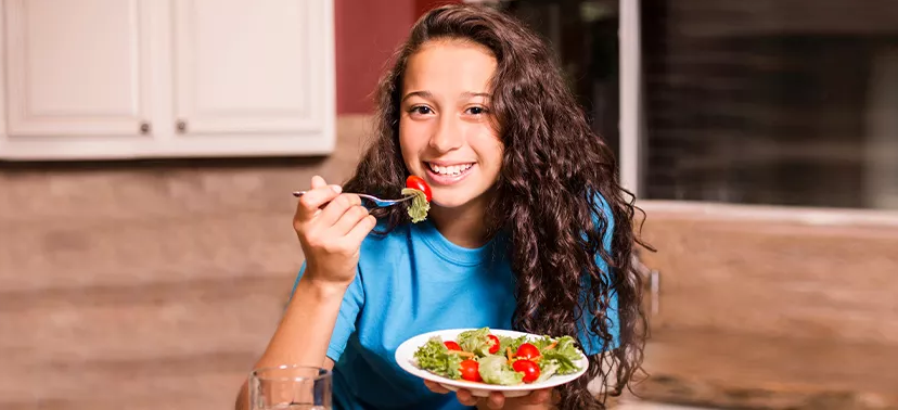 Balanced meal for teenagers with fruits, vegetables, dairy, proteins, whole grains, and healthy fats
