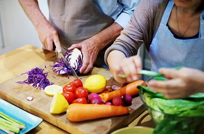 Elderly person enjoying a balanced meal with proper portion sizes and varied food groups