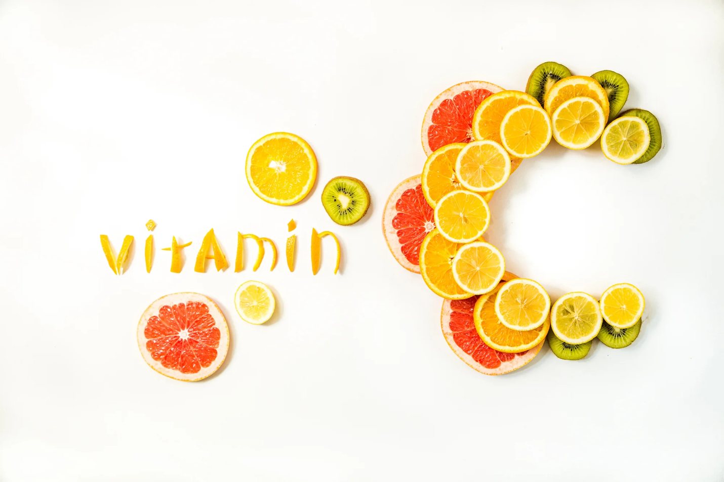 Citrus fruits, berries, and vegetables rich in vitamin C including oranges, strawberries, bell peppers, and broccoli