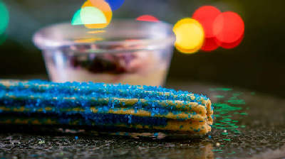 "Blueberry Looks Good on You" Churro — photo from a ParkEats review
