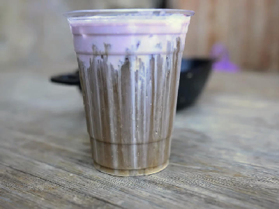 cold brew black caf with taro topper — photo from a ParkEats review