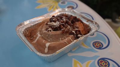 Maple Bacon Cinnamon Roll — photo from a ParkEats review