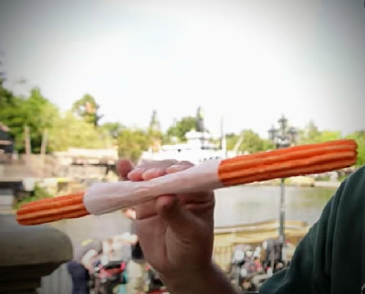 Orange Pop Churro — photo from a ParkEats review
