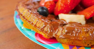 Waffle with Chocolate-Hazelnut Spread, Bananas, Berries, and Whipped Cream