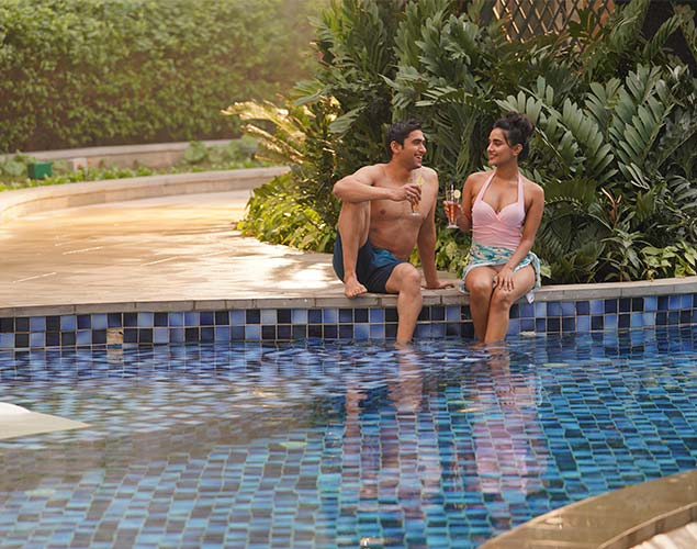 DLF Privana South — residents at the pool edge