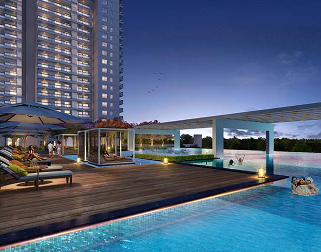 DLF Privana South — rooftop pool deck at dusk