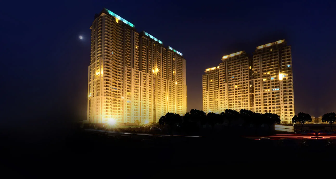 DLF The Crest — towers lit at night