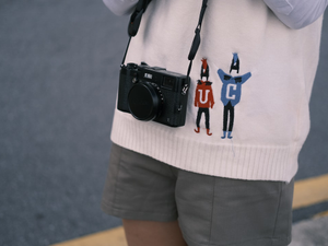 a person holding a camera and taking a picture