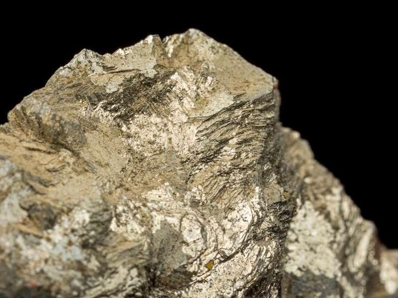 a close up of a rock with a black background