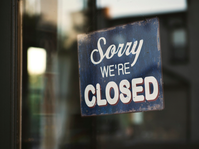 Door of a Shop with a Closed Sign