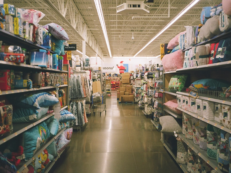 assorted items on white wooden shelf