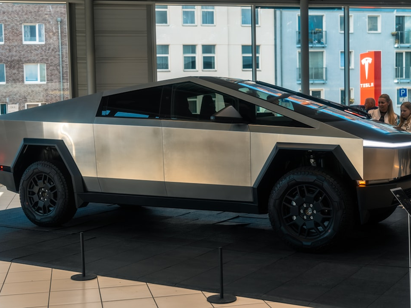 A futuristic car is on display in a building