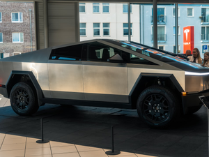 A futuristic car is on display in a building