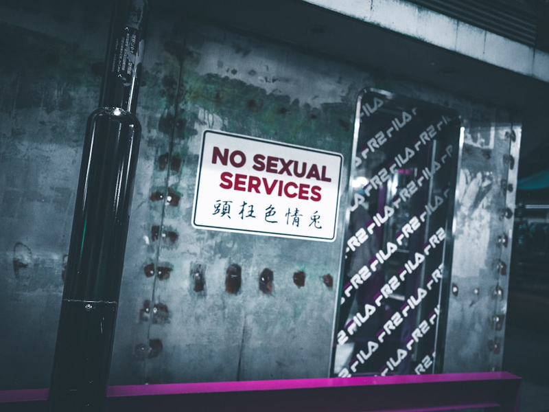 a no sexual services sign is posted on a wall