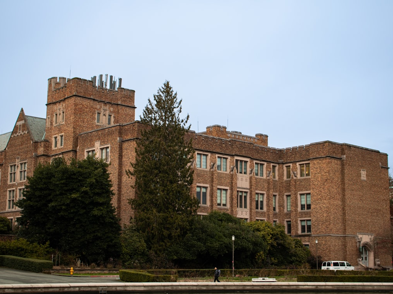 Mary Gates Hall (MGH) at the University of Washington, Seattle, is one of the university’s primary academic and student service buildings. Originally built as the Physics Hall in 1928, it was later renamed in honor of Mary Maxwell Gates. Designed in the Collegiate Gothic architectural style, MGH features intricate stonework, large arched windows, and a historic yet modernized interior. It houses classrooms, study spaces, and technology facilities, making it a central hub for students. The building exemplifies UW’s rich academic history and commitment to innovation.
