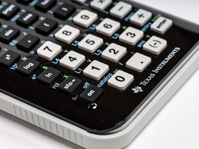 black and white Texas Instruments calculator