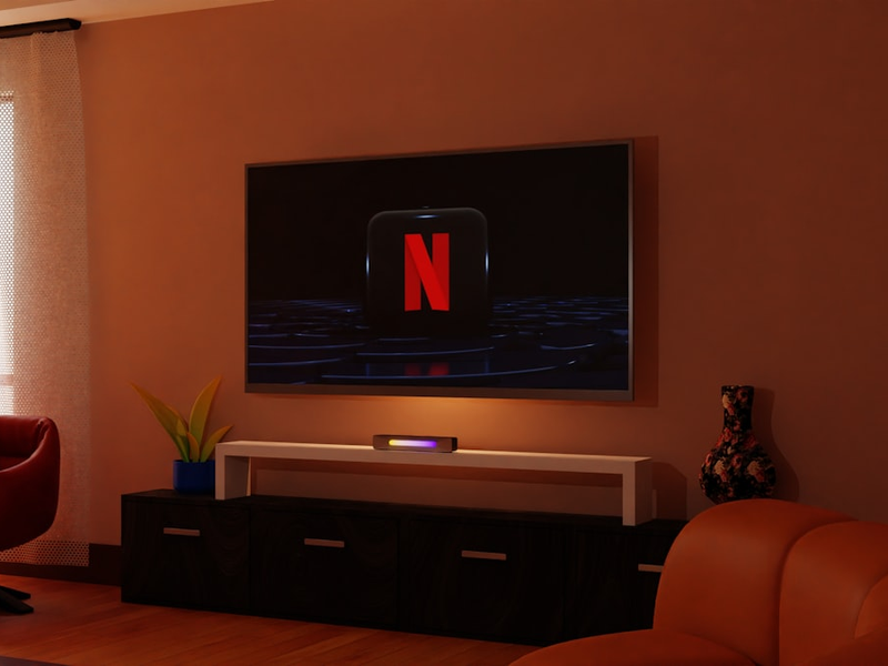 television, Netflix, Netflix logo, room, living room, entertainment, screen, technology, home, decoration, design, interior, space, relaxation, leisure, rest, streaming, streaming services, TV, flat screen, electronics, electronic devices, gadgets, tech gadgets, electronic gadgets, entertainment gadgets, home gadgets, tech gadgets, streaming gadgets, Netflix gadgets.