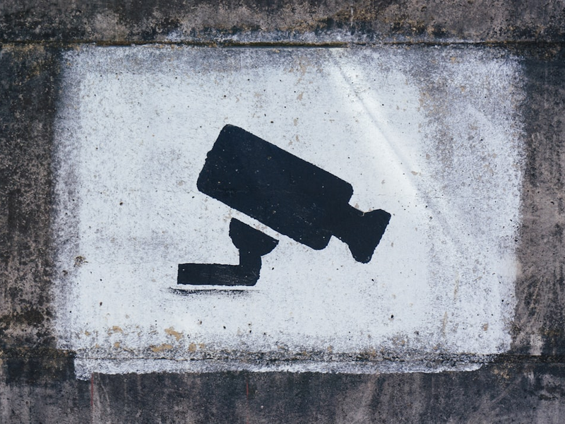 A painting on a wall warning visitors about video surveillance