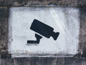 A painting on a wall warning visitors about video surveillance