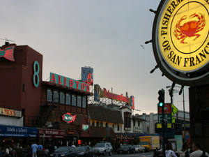 a street scene with focus on a restaurant sign