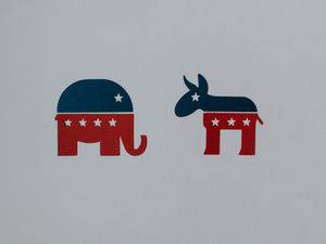 Symbols of Democrat and Republican parties cut out of paper