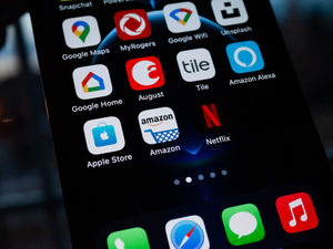 iPhone 12 Pro Home Screen with Apple Store, Amazon and Netflix apps.