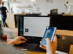 Slack message with team communicating and collaborating in app on desktop and mobile.