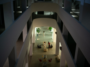 people walking on white concrete stairs