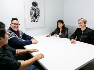 Group of people sitting around a white boardroom table. Mapbox Uncharted ERG (mapbox.com/diversity-inclusion) created these images to encourage and enable everyone in tech to represent LGBTQIA+ people at work, including collaboration and teamwork, leadership, design, engineering, and mobile development. These photos are free for anyone to use, as long as the use contains attribution to Mapbox. For more information see bit.ly/QueerTechPhotosAnnounce. For the full collection visit https://bit.ly/3chojW5