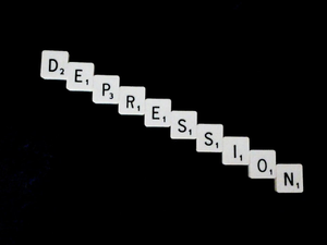Depression, spelled out in white scrabble tiles.