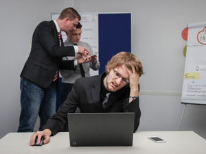 A man sitting in front of a laptop computer