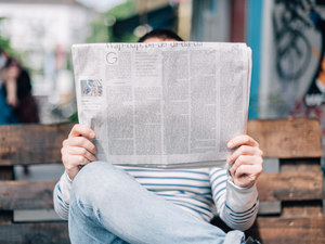 Person reading a newspaper