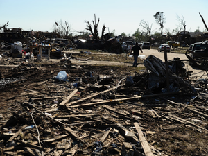 a pile of debris sitting on top of a dirt field