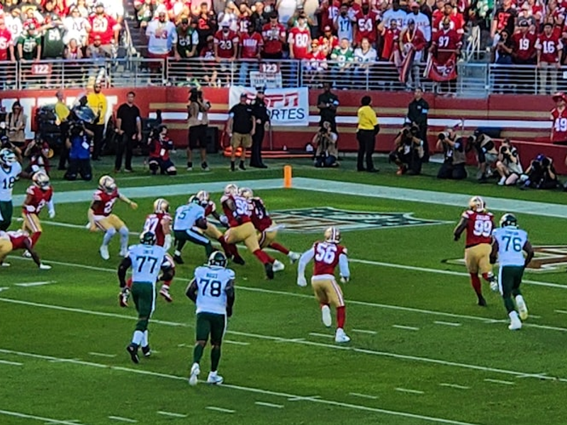 A football game is being played in a stadium