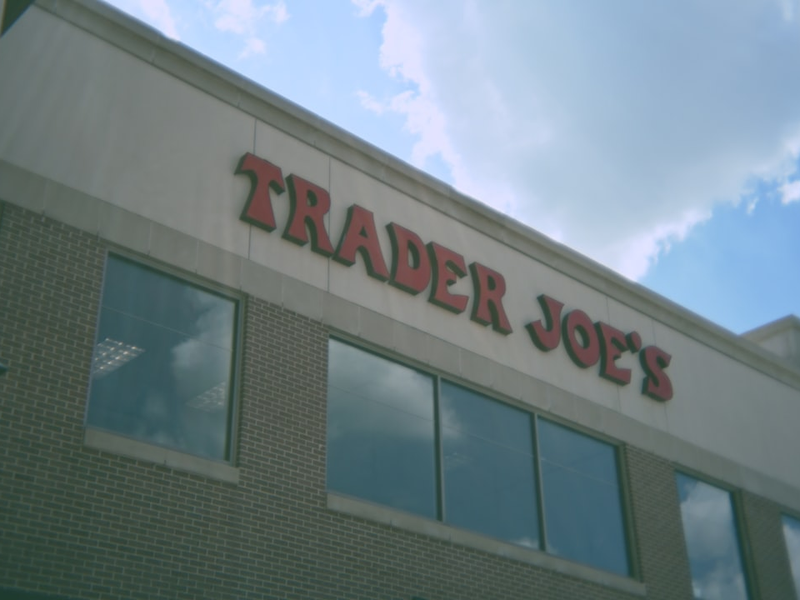A trader joe's store with the sky in the background