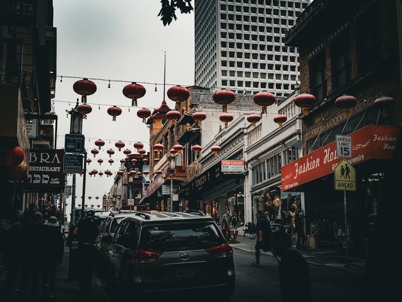 Red lanterns strung across a city street