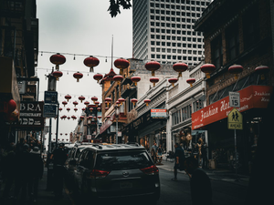Red lanterns strung across a city street