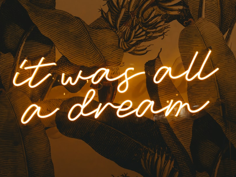 a neon sign that says it was all a dream