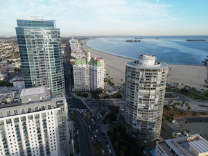 An aerial view of a city with a beach in the background