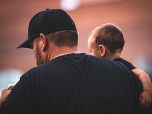 a man holding a baby
