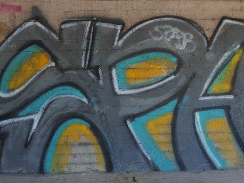 a wall with some graffiti on it