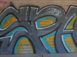 a wall with some graffiti on it