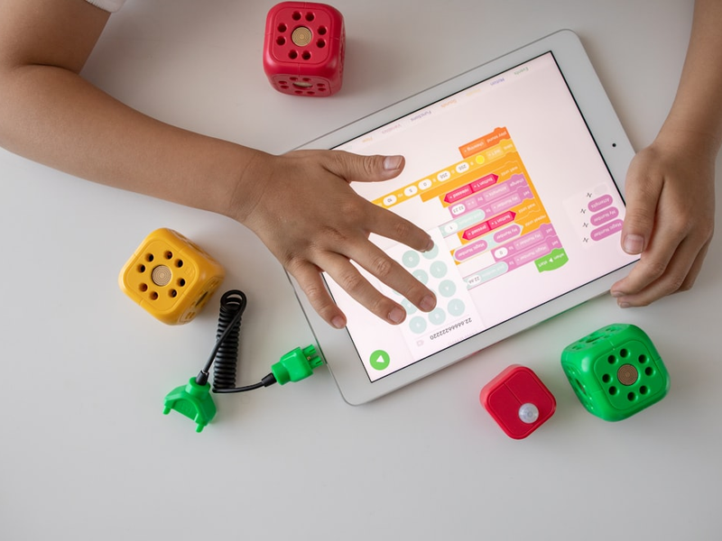 Kid using a tablet for visual programming