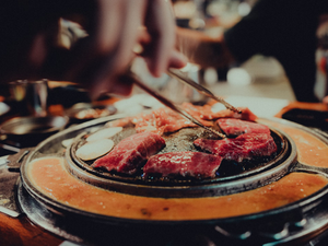 a plate of food with chopsticks sticking out of it