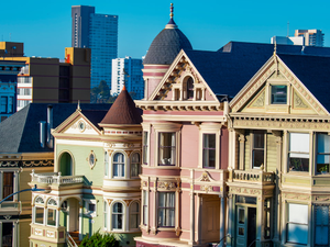 a row of victorian style houses in a city