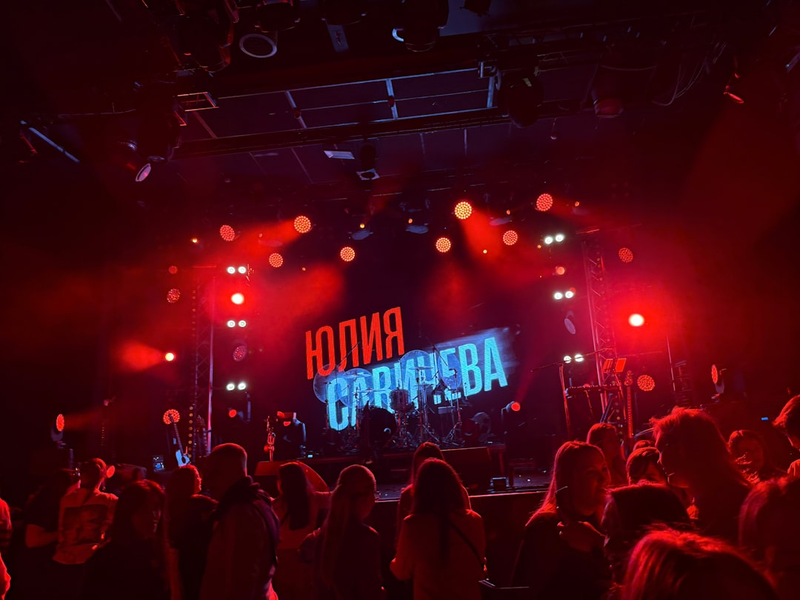 A concert stage illuminated in red light.