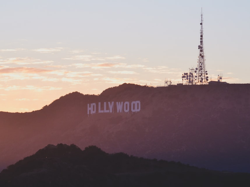 A view of the hollywood sign at sunset
